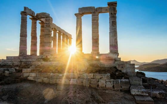 Sunset over the ancient Temple of Poseidon at Cape Sounion, Greece